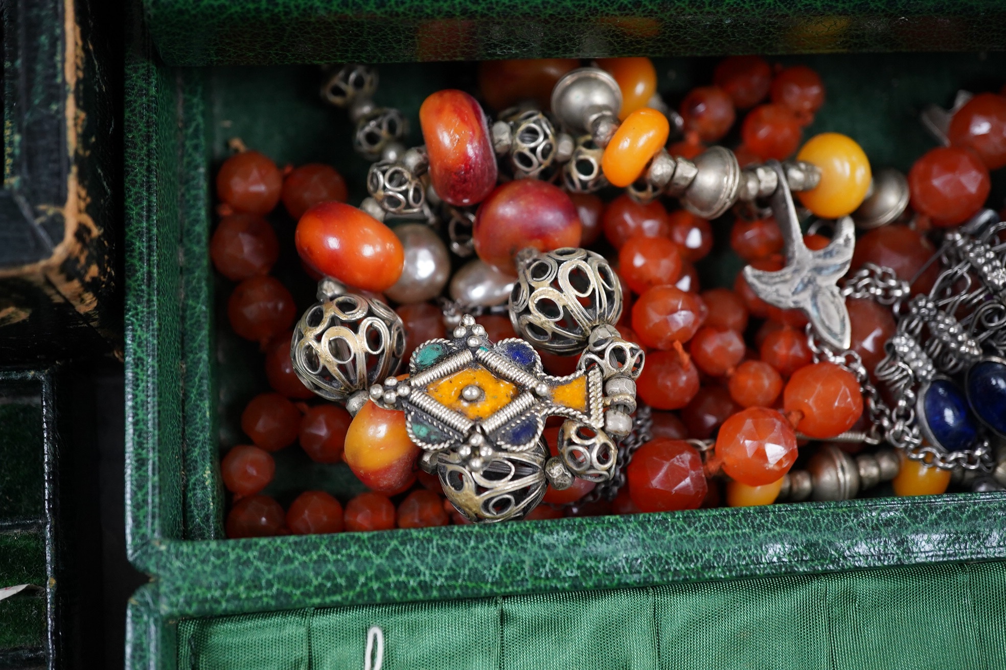 A quantity of assorted mainly costume jewellery in two boxes, including a coral bead necklace. Condition - poor to fair